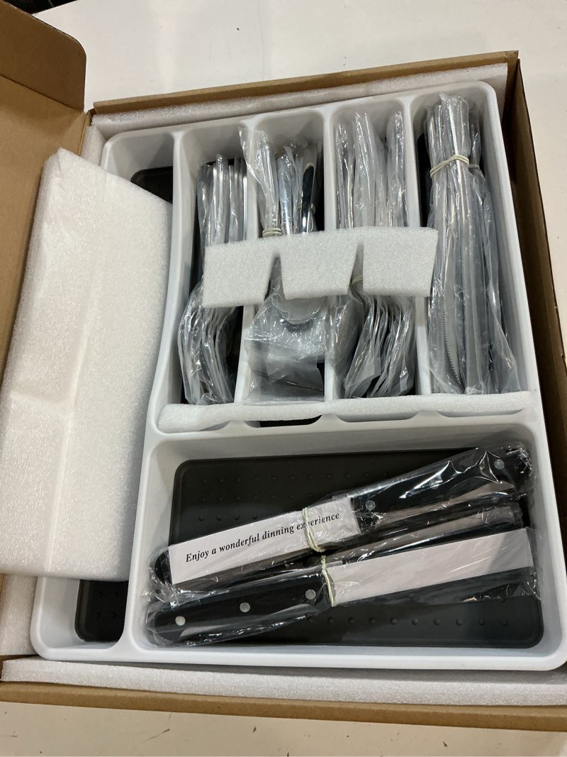 Condition photo showing New/Like New for 49-piece silverware set with organizer, heavy duty stainless steel flatware set for 8, cutlery utensil sets with steak knives, rust-proof, mirror polished, dishwasher safe, heavy duty