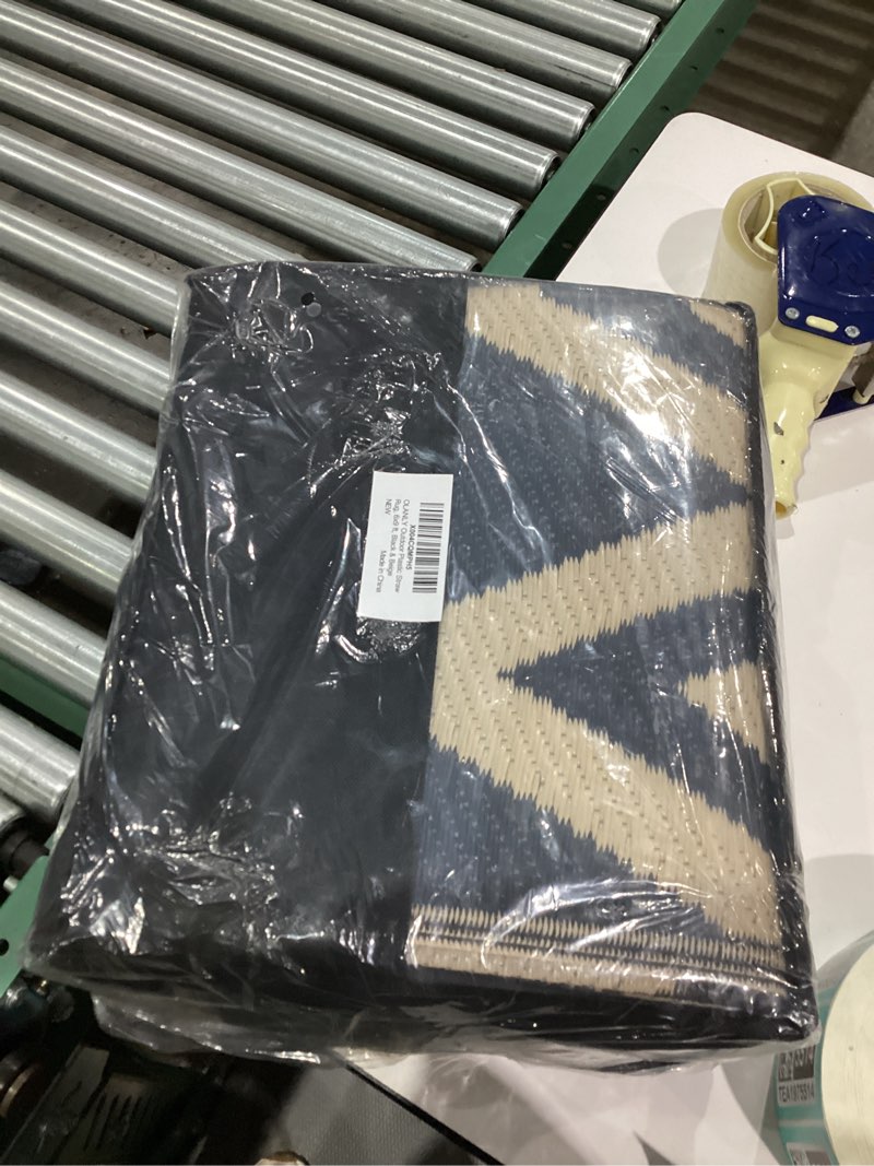 Condition photo showing New/Like New for OLANLY Waterproof Outdoor Rug 6x9 ft Clearance, Reversible Outdoor Plastic Straw Rug, RV Mat, Indoor Outdoor Carpet for Patio, Camping, Balcony, Deck, Backyard, Black & Beige Black & Beige Chevron 6' x 9' (Rectangular)