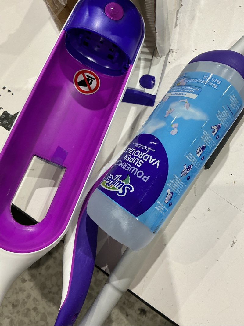 Condition photo showing As Is for swiffer powermop multi-surface mop kit for floor cleaning, includes powermop, 2 mopping pad refills, 1 cleaning solution with fresh scent and 2 batteries purple and white