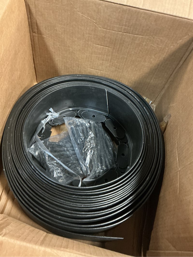 Condition photo showing As Is for 4 in x 50 Ft Garden Landscape Edging, No Dig Garden Edging Border Kit with 92 Pcs Spikes for Flower Bed Lawn Yard Grass Black 4in x 50ft Black