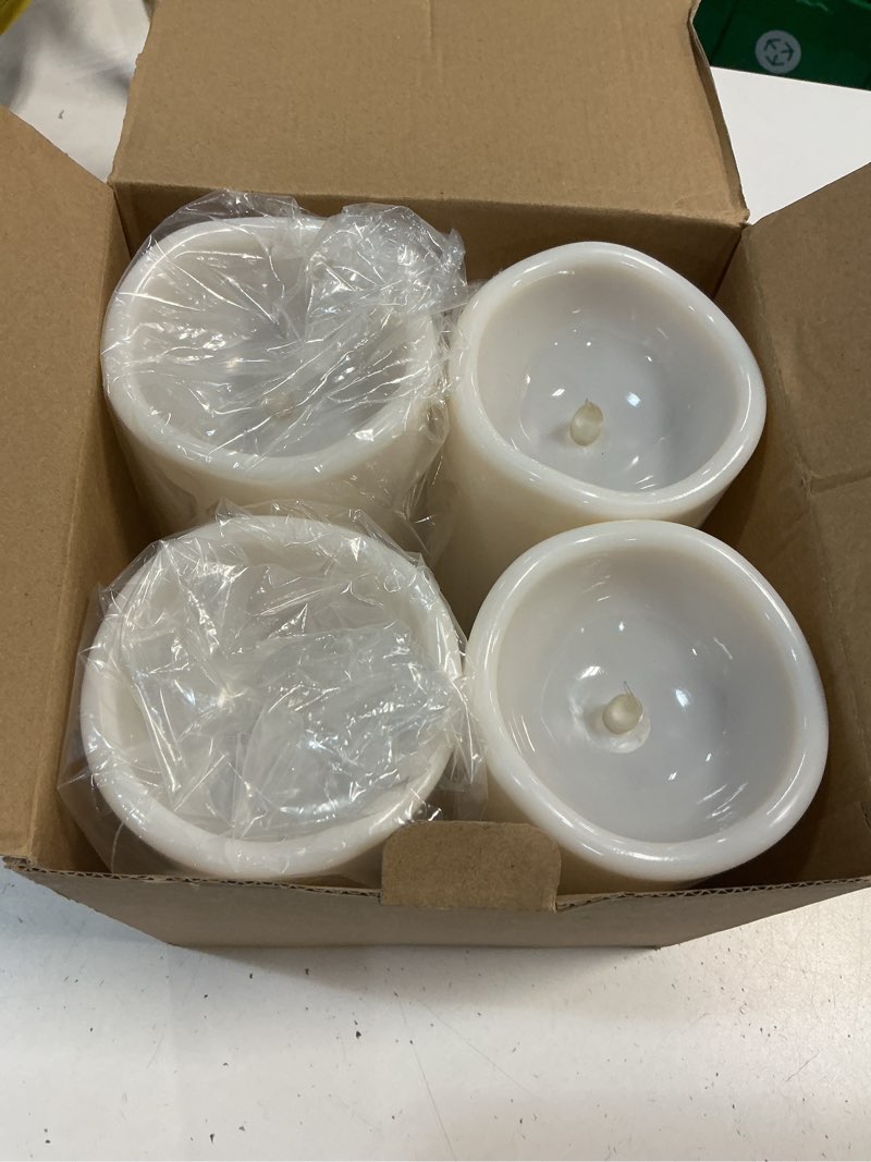 Condition photo showing Good Condition for homemory 4" x 8" large waterproof outdoor flameless candles with remote control and timer, battery operated flickering led pillar candles for indoor outdoor lanterns, porch, long lasting, set of 4 ivory white 4"x 8", 4 pack