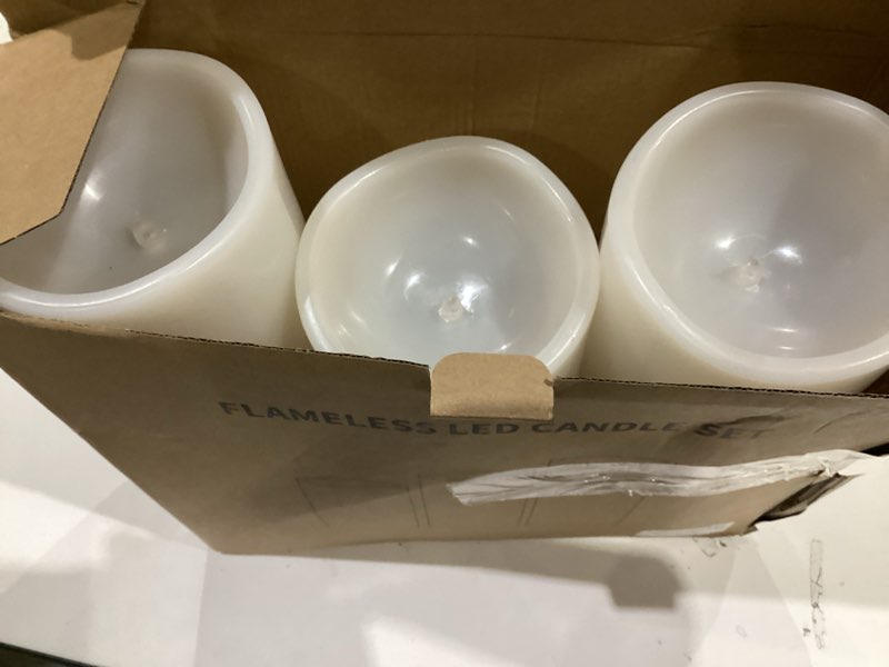 Condition photo showing New/Like New for 10" 12" 14" x 5" Extra Large Waterproof Outdoor Flameless Candles Battery Operated LED Pillar Candles for Indoor Outdoor Lanterns, Off White, Long Lasting, Set of 3 Off-White 10" 12" 14" x 5"