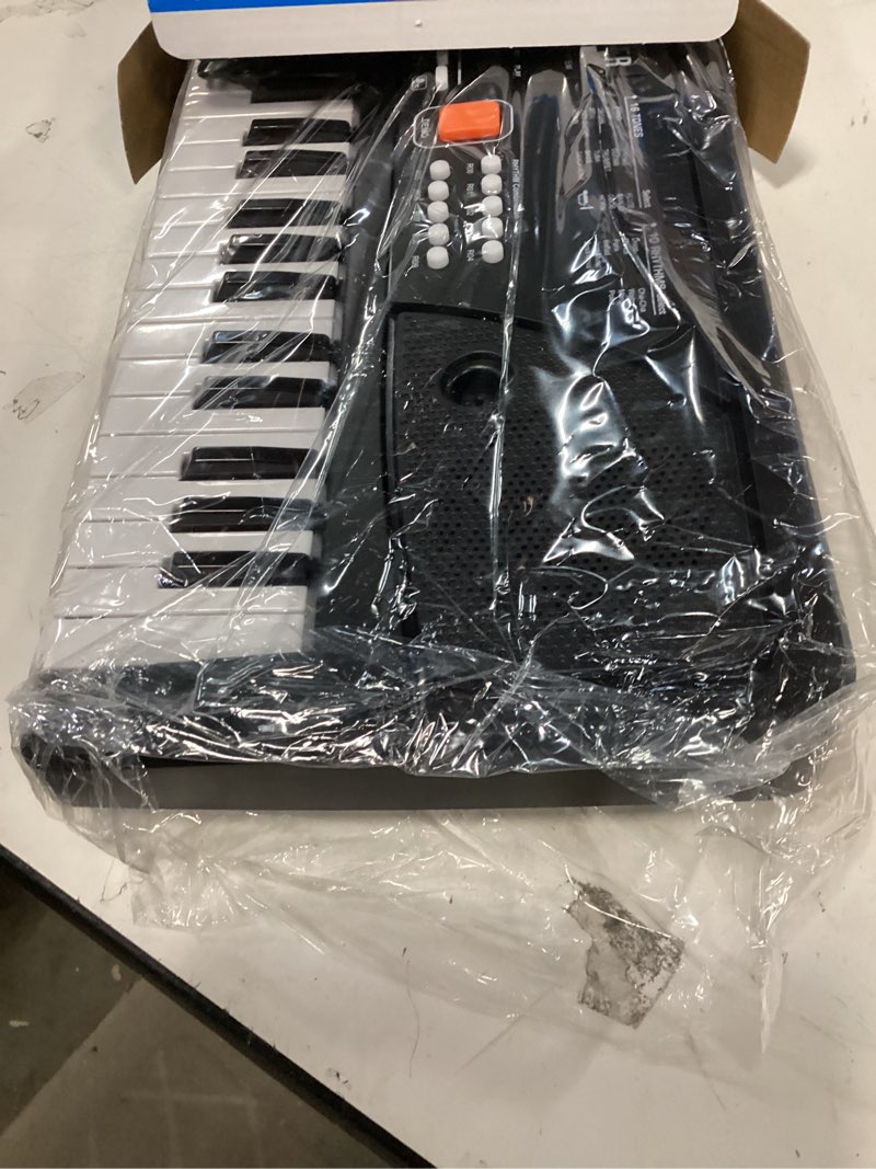 Condition photo showing Good Condition for Raimy Piano Keyboard for Beginners, 61 Keys Portable Electronic Digital Piano with Microphone, Learning Educational Music Keyboard Piano for Kids Gifts Toys for Boys Girls Toddlers (Black)