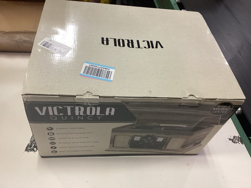 Condition photo showing New/Like New for victrola the quincy 6-in-1 bluetooth record player & multimedia center with built-in speakers – 3-speed turntable, cd & cassette player, fm radio, wireless music streaming (farmhouse shiplap grey) farmhouse shiplap grey record player