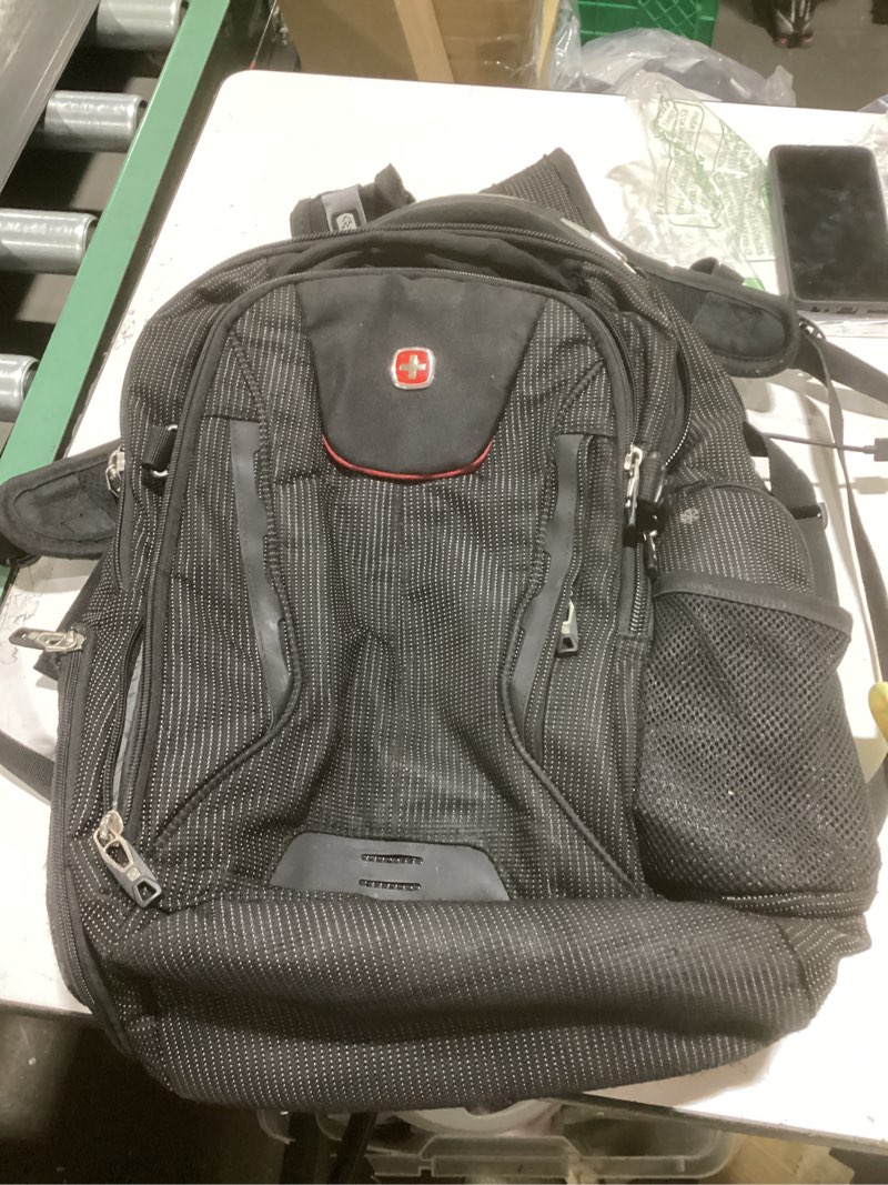 Condition photo showing As Is for **similar to** (used)swissgear travel tech elite laptop backpack – fits laptops up to 16” – scansmart tsa-friendly backpack with usb port, shoe compartment & organizer pockets – black dot travel tech elite black dot