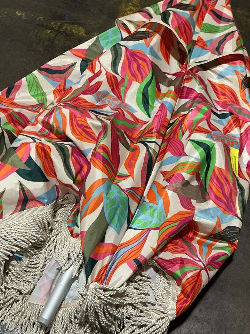 Condition photo showing As Is for tropical beach umbrella with fringe