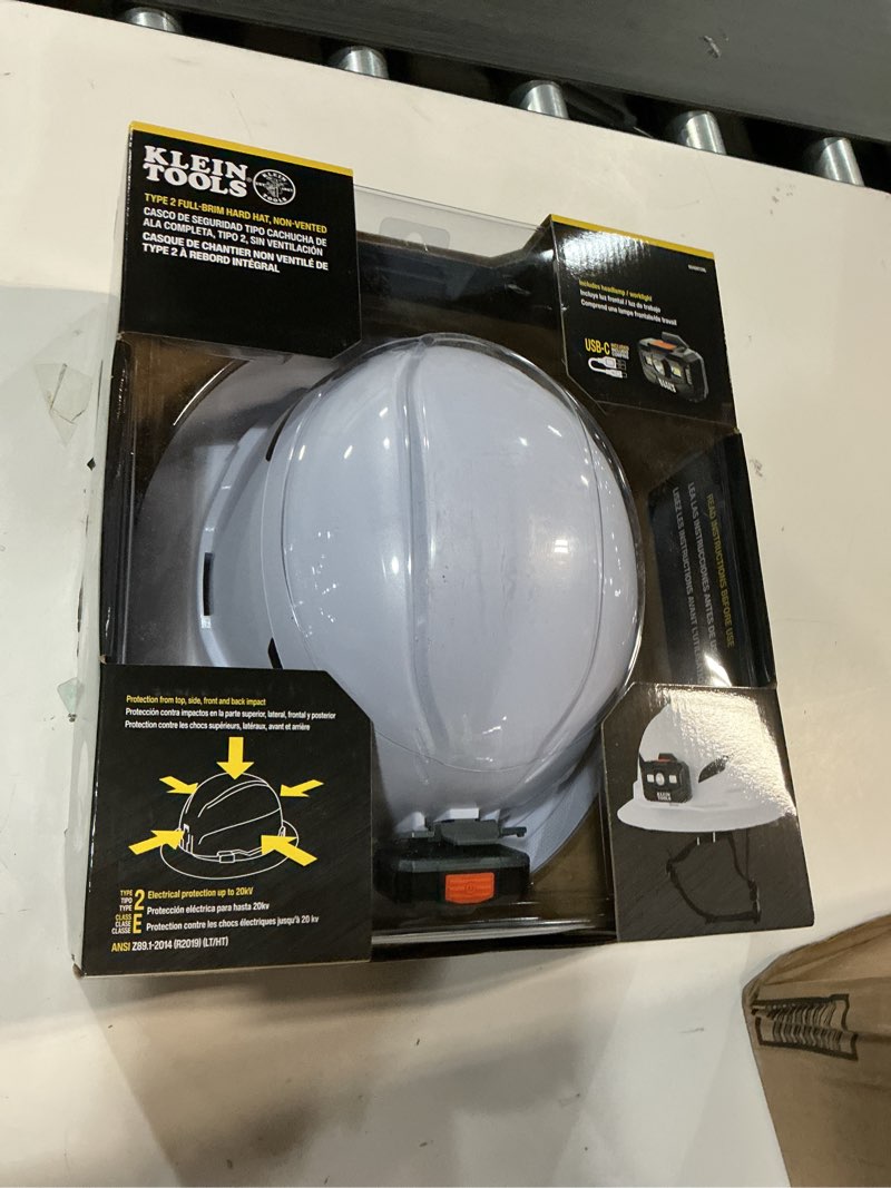 Condition photo showing New/Like New for Klein Tools 60406T2RL Type 2 Hard Hat, Non-Vented Full Brim, Class E Hard Hat with Chin Strap, 6-Point Suspension with Accessory Mounts, Washable Padding, and Rechargeable Headlamp Hard Hat w/Light