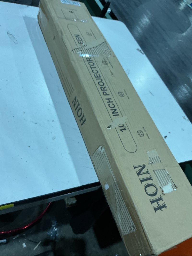 Condition photo showing As Is for 10 inch projector screen 