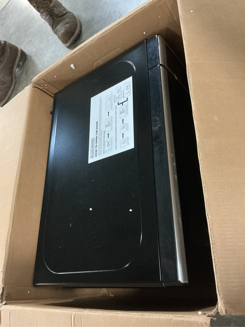 Condition photo showing As Is for BLACK+DECKER EM720CB7 Digital Microwave Oven with Turntable Push-Button Door, Child Safety Lock, 700W, Stainless Steel, 0.7 Cu.ft 0.7 cu. ft.