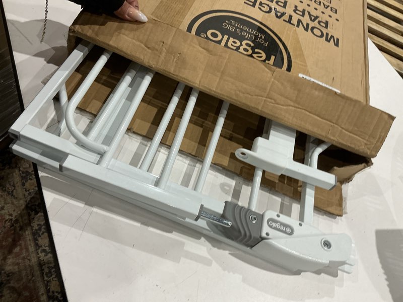 Condition photo showing As Is for regalo safety 29-38.5" baby gate for doorways & bottom of stairs, pressure mounted baby gate with door for babies, toddlers & pets, tested & safe for 30 years, american designed, american owned, white white 29-38.5"w x 30"h