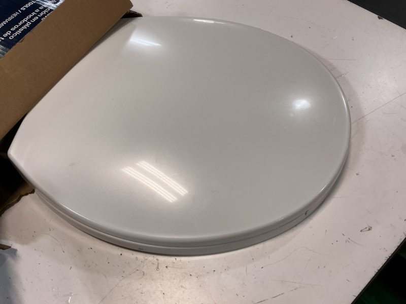 Condition photo showing As Is for project source plastic white round soft close toilet seat