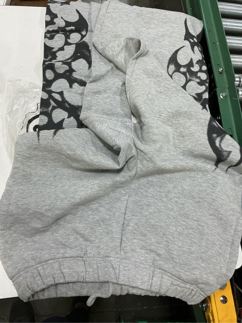 Condition photo showing New/Like New for uo cyber graphic swe grey l