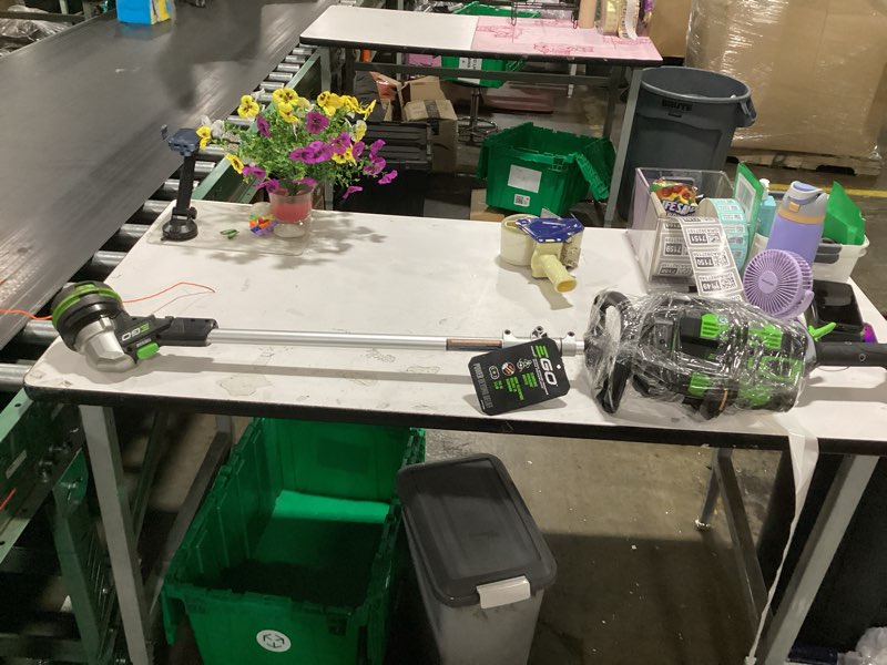 Condition photo showing As Is for ego st1511t 15-inch 56-volt lithium-ion cordless string trimmer kit alu foldable shaft battery and charger included, 15in powerload/telescopic/gauge(2.5ah), black