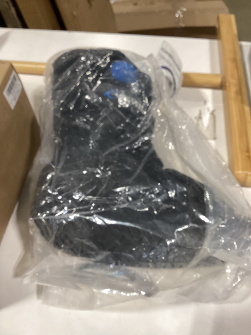 Condition photo showing As Is for similiar product united ortho short air cam walker fracture boot, large, black black large boot