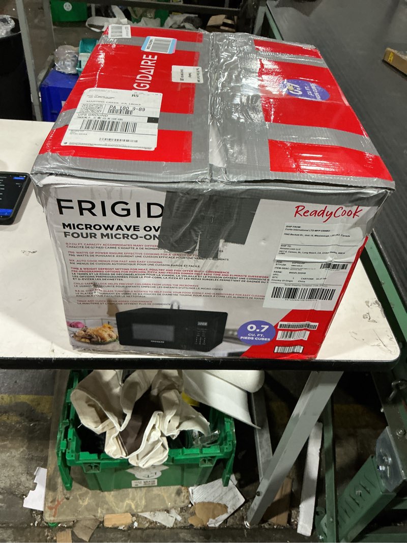 Condition photo showing As Is for frigidaire emw736blk 0.7 cu. ft. microwave, black