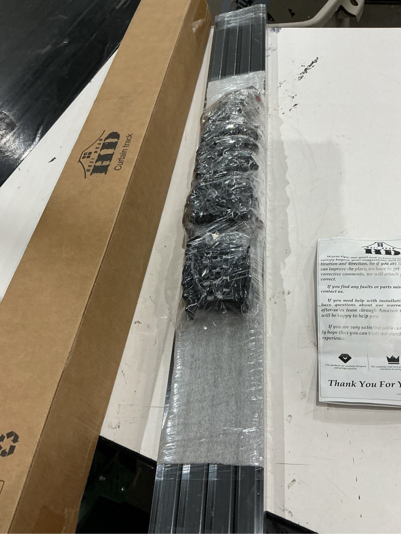 Condition photo showing New/Like New for hei! dear curtain track 15-18ft black – adjustable ceiling/wall mount, heavy duty curtain rail system with 60 rollers, 60 hooks & 60 hei! dear clips, room divider for grommet/pleated curtains