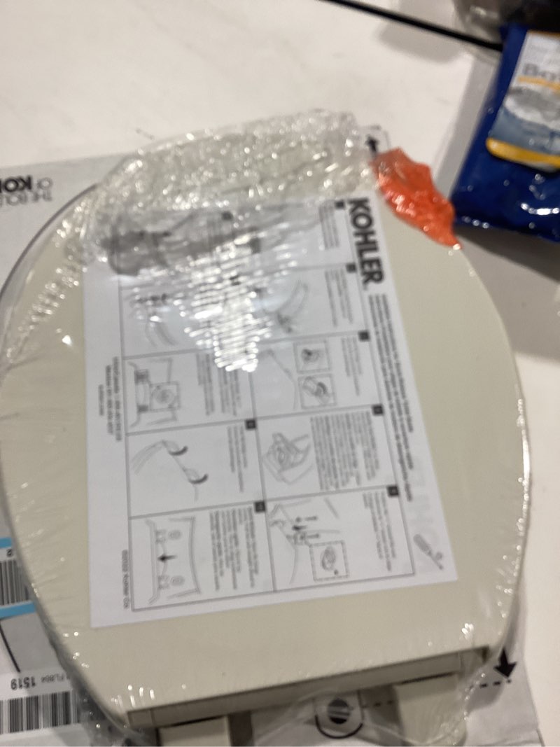 Condition photo showing New/Like New for kohler k-4775-96 brevia round toilet seat with quick-release hinges and quick-attach hardware for easy clean, biscuit round biscuit
