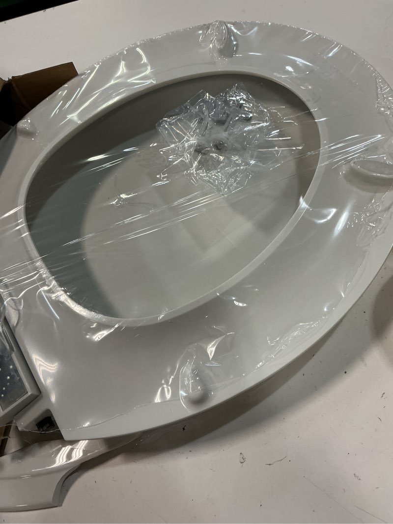 Condition photo showing As Is for kohler 78059-rl-0 rutledge nightlight readylatch slow close toilet seat, round-front, quiet-close lid and seat, grip-tight bumpers, white round white nightlight
