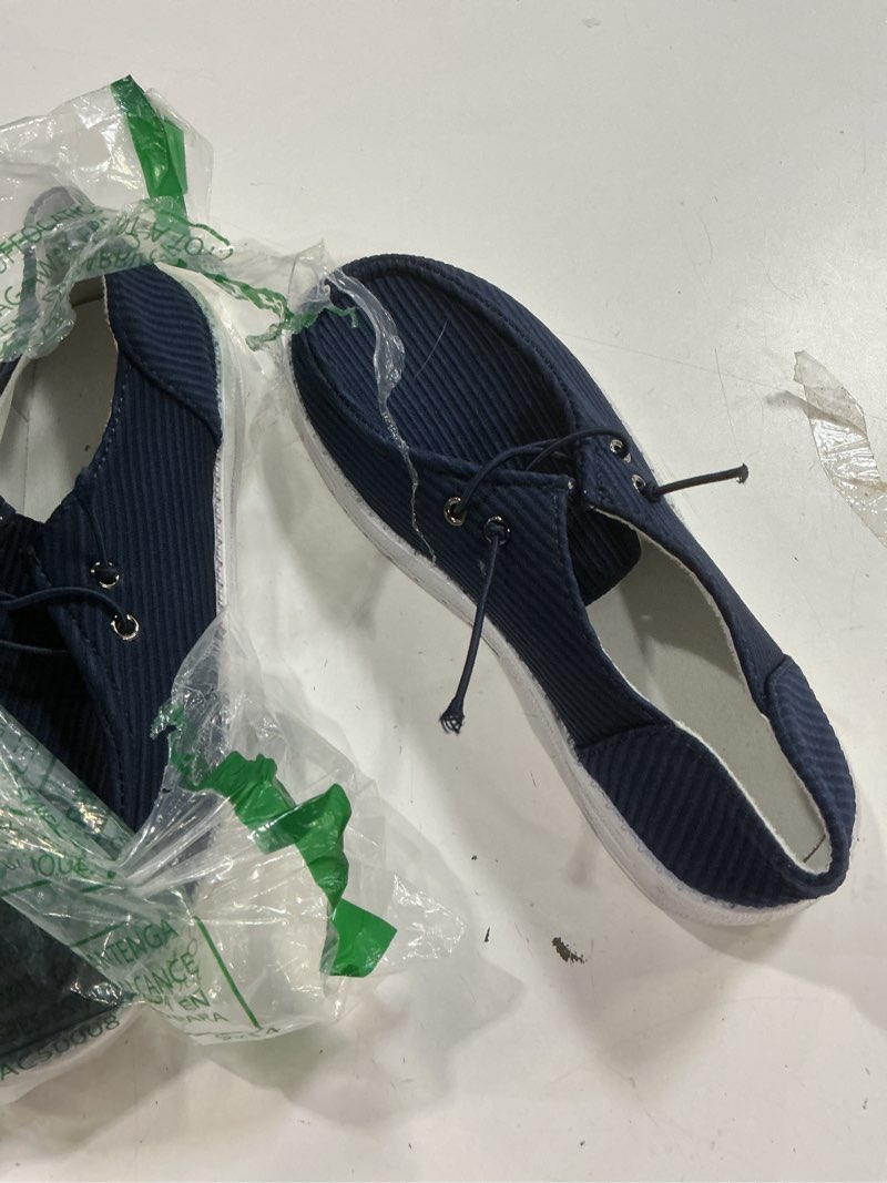 Condition photo showing As Is for (unknown size) womens breathable boat shoes