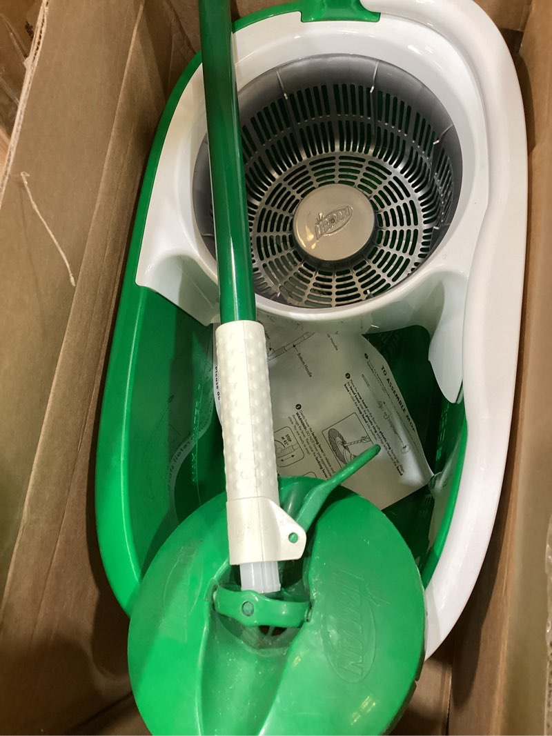 Condition photo showing As Is for libman tornado spin mop system and 1 refill, mop and bucket with wringer set for hardwood floor cleaning, 2 total heads included spin mop plus 1 refill