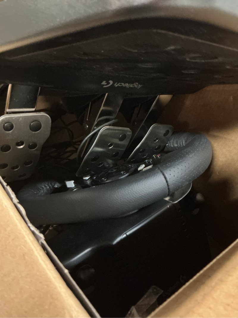 Condition photo showing As Is for logitech g920 driving force racing wheel and floor pedals, real force feedback, stainless steel paddle shifters, leather steering wheel cover for xbox series x|s, xbox one, pc, mac - black wheel kit - black