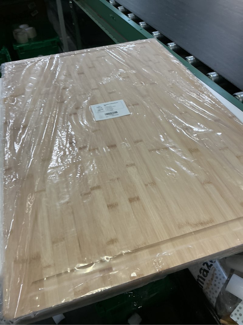 Condition photo showing New/Like New for 36 x 24 extra large bamboo cutting board for kitchen, cutting board stove top cover with handle, butcher block chopping board with juice groove, large charcuterie board over the sink natural 36"l x 24"w