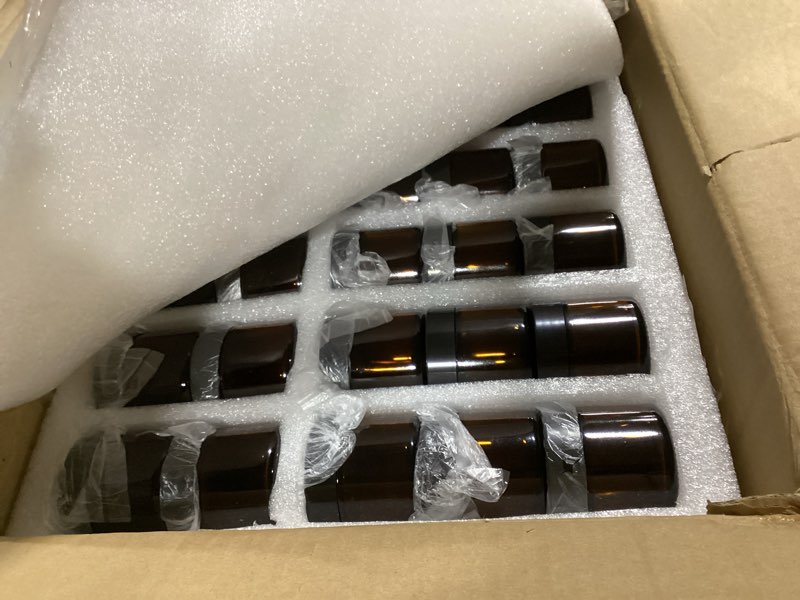 Condition photo showing Good Condition for Layhit 90 Pcs 2 oz Glass Jars with Lids Bulk, Small Jars Containers Travel Storage Jar with Inner Liners Labels for Candle Scrubs, Lotions, Cream, Lip Balm (Amber,Black Lid) Amber, Black 90