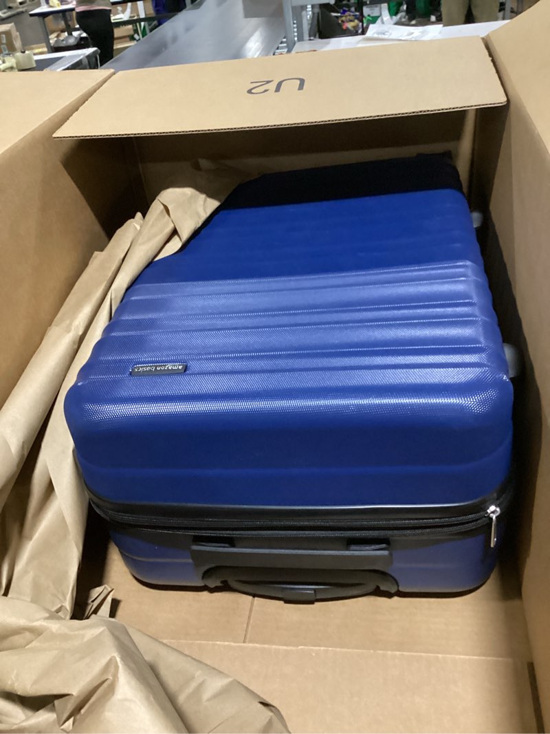 Condition photo showing New/Like New for Amazon Basics 26" Hardside Medium Checked Luggage, Hardshell Suitcase With Wheels, Expandable For Up to 15% More Space, With Scratch-Resistant Surface, Four Multi-directional Wheels, Navy Blue Navy Blue Medium Checked