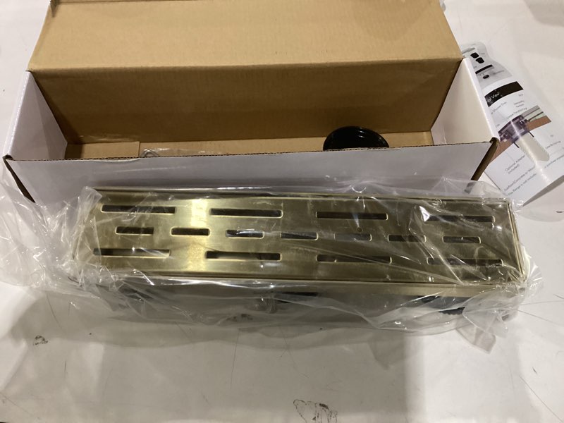 Condition photo showing New/Like New for WEBANG 12 Inch Linear Shower Drain Rectangular Floor Drain with Accessories Rainline Pattern Cover Grate Removable SUS304 Stainless Steel CUPC Certified Brushed Gold Brushed Gold 12 Inch
