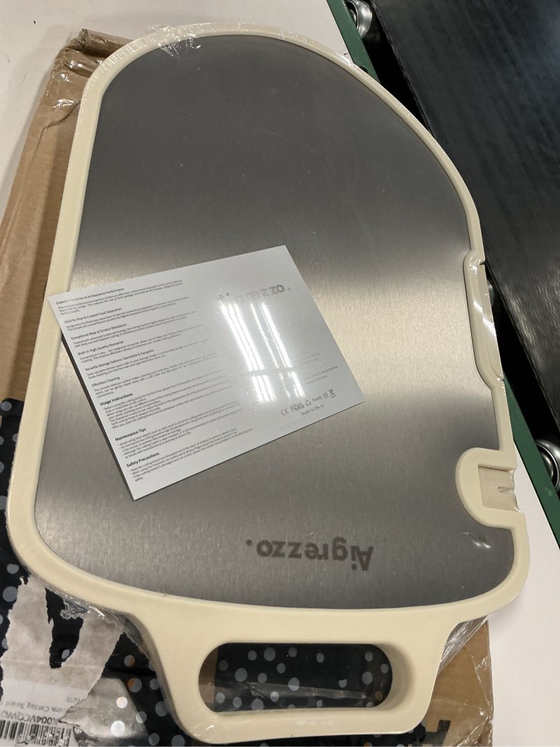 Condition photo showing New/Like New for titanium & pp cutting board, double-sided, 17.5"x11" | knife sharpener, juice groove, garlic grinding & non-spill edge, dishwasher safe