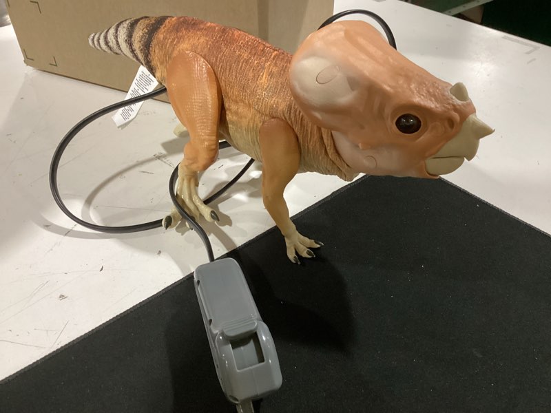 Condition photo showing As Is for wow! stuff: jurassic world dolores deluxe puppetronic by realfx - interactive baby aquilops, 30+ actions & sounds, realistic 15" dinosaur toy, ages 8+