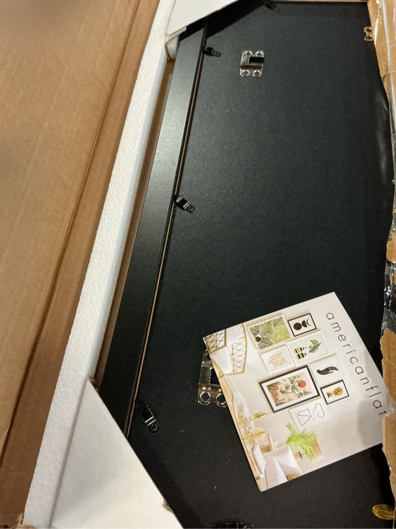 Condition photo showing Good Condition for americanflat 14x20 poster frame - black engineered wood with polished plexiglass - wide picture frame for vertical or horizontal wall display - epic collection - black 14x20 black