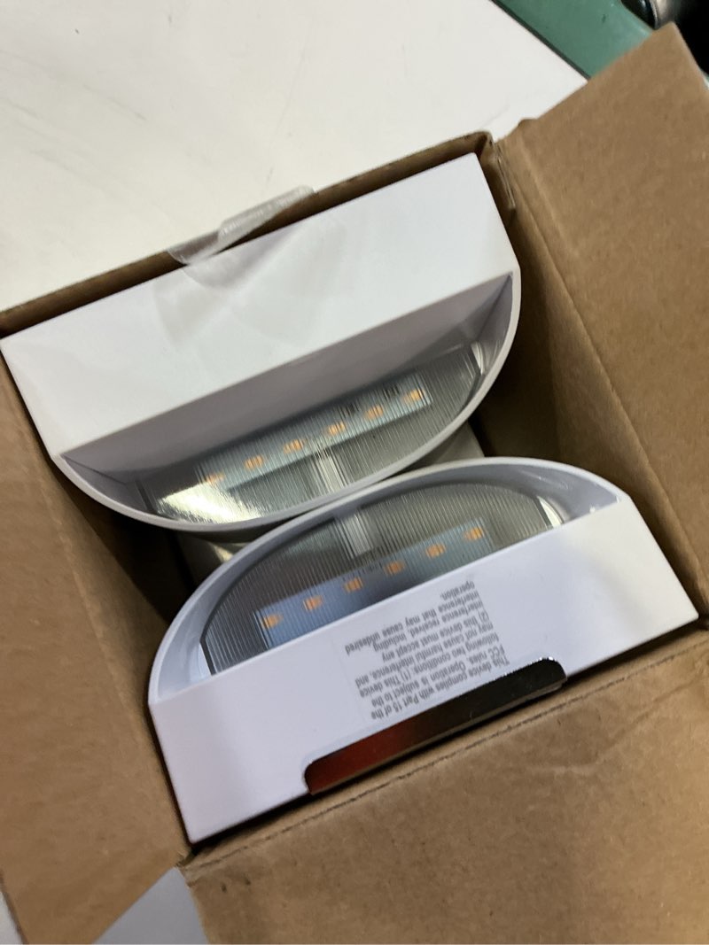 Condition photo showing Good Condition for utilitech 2-pack 4-in white rechargeable motion activated led wall sconces