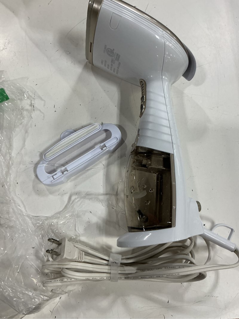 Condition photo showing As Is for conair handheld garment steamer for clothes, turbo extremesteam 1875w fabric steamer, portable handheld design, strong penetrating steam, white/champagne