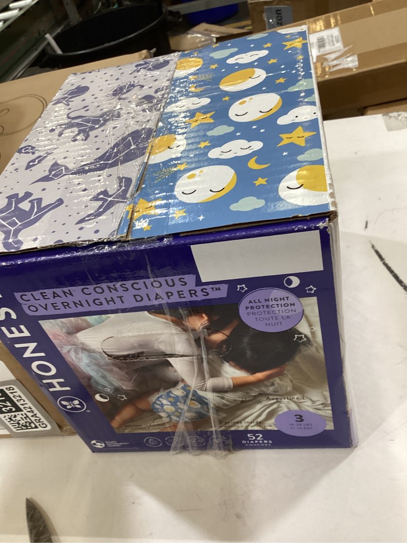 Condition photo showing New/Like New for the honest company comfort dry overnight diapers, up to 12 hours protection, hypoallergenic, cozy cloud + star signs, club box size 3 (16–28 lbs), 52 count size 3 52