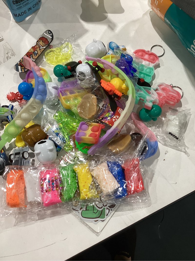 Condition photo showing Good Condition for 124 pcs party favors for kids 4-8, birthday gift toys, goodie bag stuffers, treasure box carnival prizes, gifts classroom, pinata bags filler boys and girls 8-12
