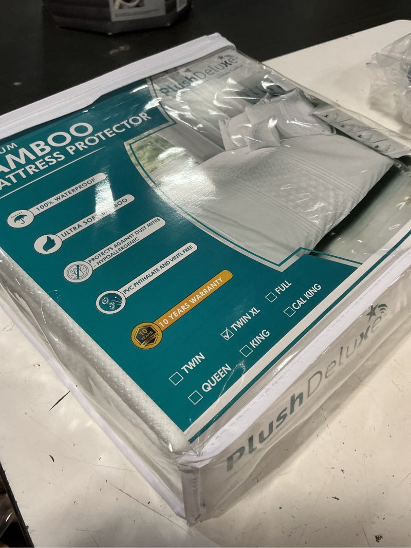 Condition photo showing New/Like New for plushdeluxe premium bamboo mattress protector – twin xl size, waterproof, & ultra soft breathable noiseless washable bed mattress cover for comfort & protection - white