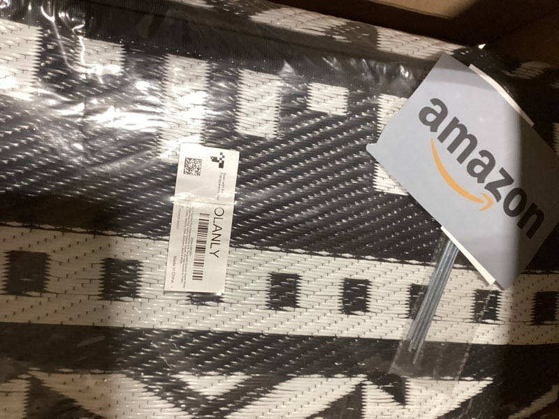 Condition photo showing As Is for olanly outdoor rug waterproof 8x10 ft, reversible outdoor plastic straw rug, boho patio rug, indoor outdoor carpet, rv mat outside for patio, camp, picnic, balcony, deck, backyard, black & white black & white 8' x 10' (rectangular)