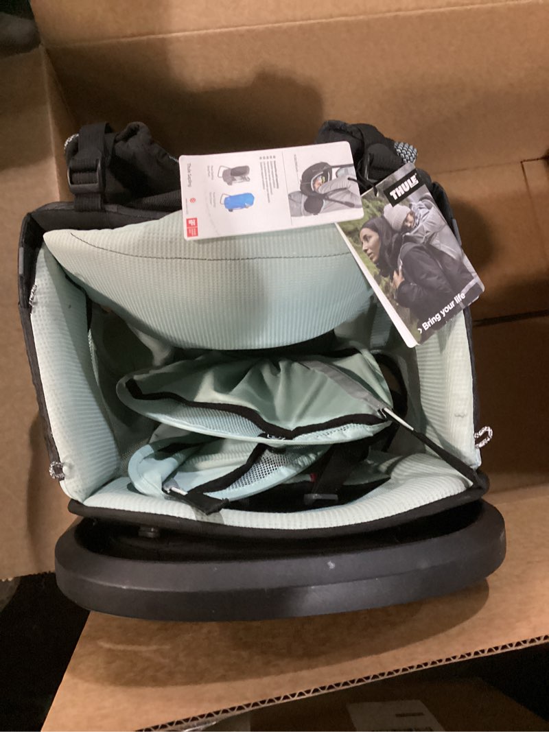 Condition photo showing As Is for Thule Sapling Child Carrier Backpack - Machine Washable Seat - Self-Standing Frame - Adjustable padded straps for parents - Ergonomic seat with under-leg support for child - UPF 50 Sunshade Black