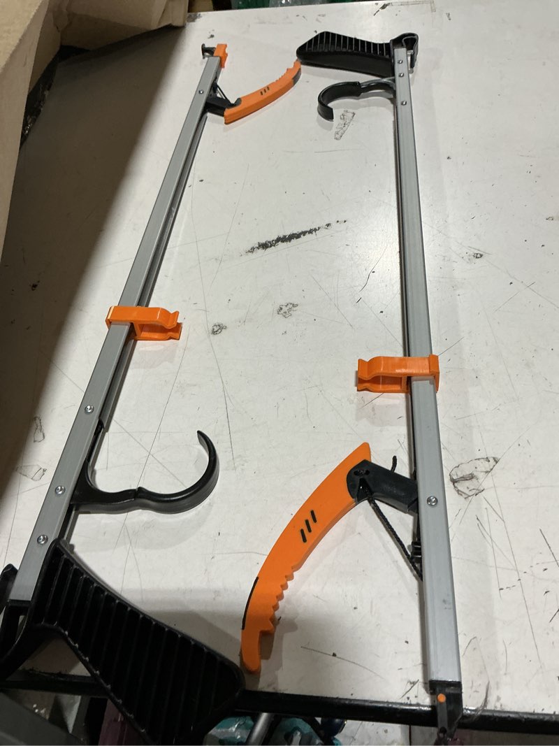 Condition photo showing Good Condition for sammons preston easireach ii, featuring a lightweight aluminum body with a distinctive orange, rubberized jaw for secure gripping