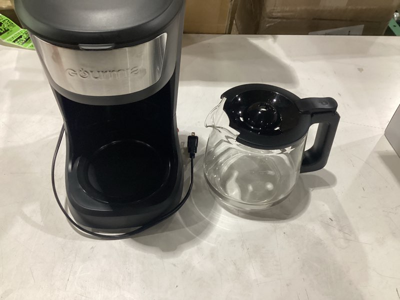 Condition photo showing Good Condition for **untested** gourmia 12 cup one-touch coffee maker – pause and serve with automatic keep warm, easy view water window, compact design, stainless steel accents, black