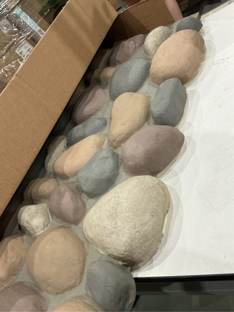 Condition photo showing As Is for everstone river rock faux rock panel, 49"w x 24 3/4"h x 3"d, pebble mix color