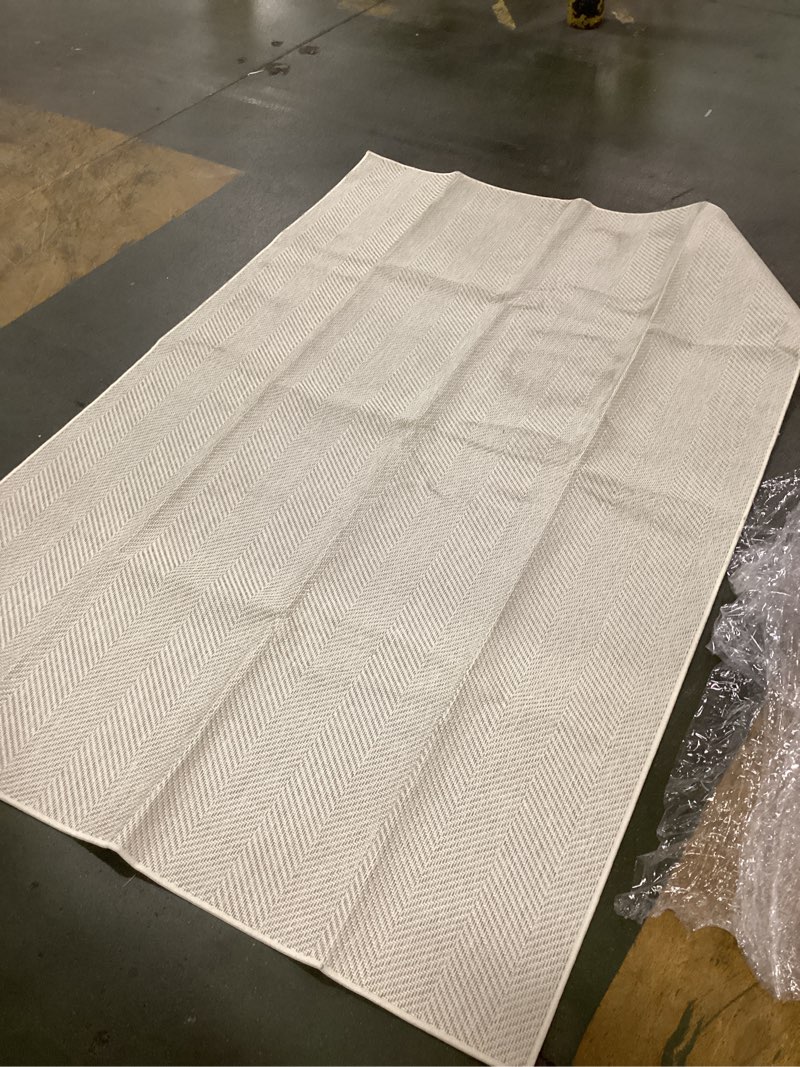 Condition photo showing As Is for SAFAVIEH Area Rug 8x10 - Marbella Collection - Large - Silver, Handmade Wool & Viscose, Ideal for Living Room, Bedroom, Office, Dining Space (MRB721A) 8' x 10' (Rectangular) Silver