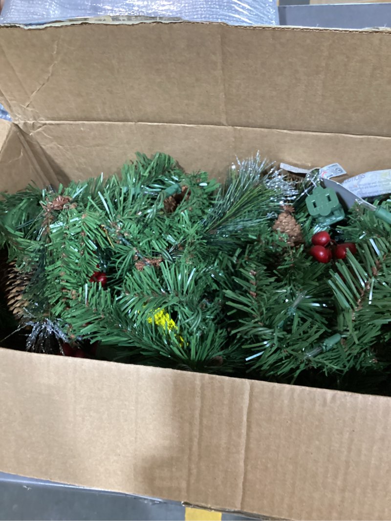 Condition photo showing New/Like New for national tree company 9 ft pre-lit crestwood spruce artificial christmas garland, christmas decoration with glitter, pinecones, red berries, 50 clear lights, 180 tips, green plug in tree