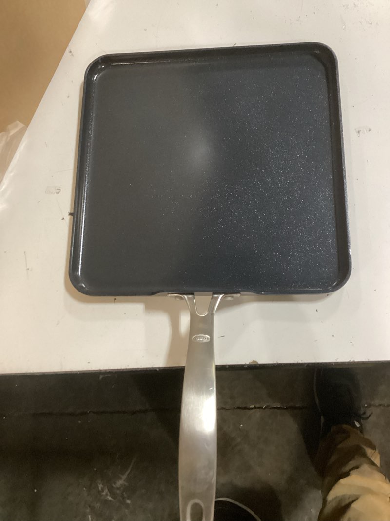 Condition photo showing Good Condition for oxo enhanced 11" griddle pan, pfas-free ceramic nonstick, durable hard anodized cookware, scratch resistant, stainless steel handle, good grips, dishwasher safe, oven safe, black