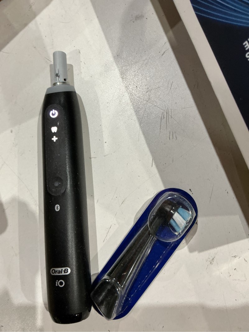Condition photo showing Good Condition for oral-b rechargeable electric toothbrush, io5 customizable clean, 5 cleaning modes, visual pressure sensor to protect gums, travel case, black