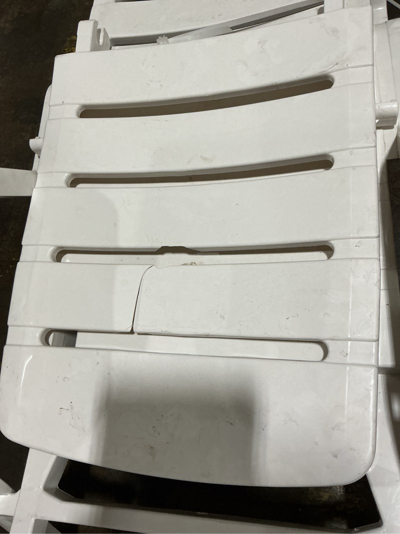 Condition photo showing As Is for adams manufacturing stackable white plastic frame stationary chaise lounge chair(s) with slat seat