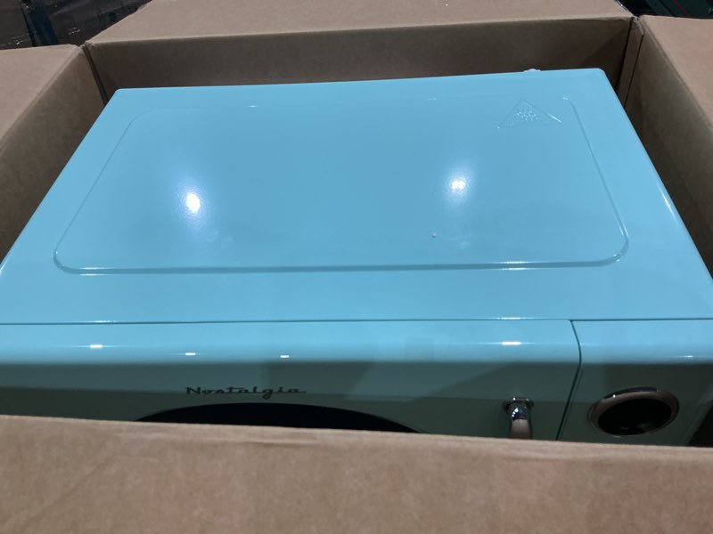 Condition photo showing Good Condition for retro microwave-1.1 cu. ft. and 1000 watt countertop microwave-aqua