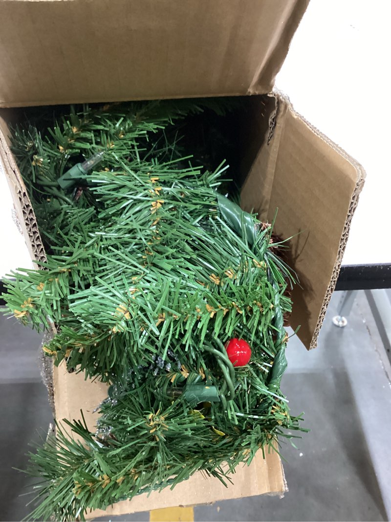 Condition photo showing Good Condition for national tree company 9 ft pre-lit crestwood spruce artificial christmas garland, christmas decoration with glitter, pinecones, red berries, 50 clear lights, 180 tips, green plug in tree