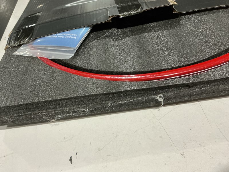 Condition photo showing As Is for automotive alloy wheel rim protector - covering the entire rim of the wheel hub - strips for curb rash prevention - set of 4 rim protector easy to install(19'',red) 19'' red